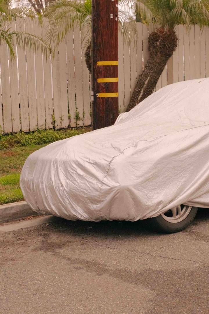 Car under a storage cover outdoors